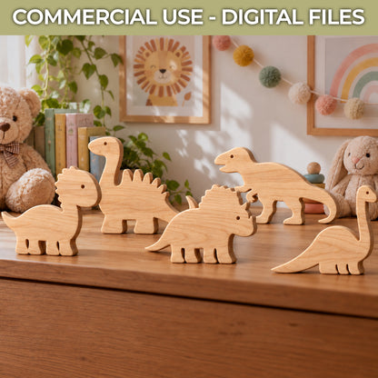 Five natural wood dinosaur toy cutouts arranged on a wooden dresser in a child's room, with teddy bears, framed wall art, and a rainbow pom-pom garland in the background. Text at the top reads 'COMMERCIAL USE - DIGITAL FILES'.